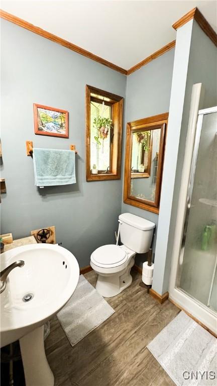 1155 County Route 53, Scriba, NY 13126 - bathroom with a shower stall, wood finished floors, and crown molding