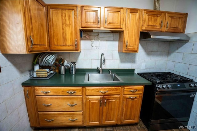 14 Phyllis Ave, Buffalo, NY 14215 - kitchen with range with gas stovetop, exhaust hood, dark countertops, and brown cabinets