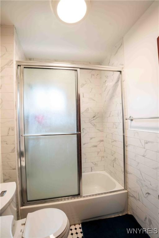 14 Phyllis Ave, Buffalo, NY 14215 - bathroom featuring toilet and enclosed tub / shower combo