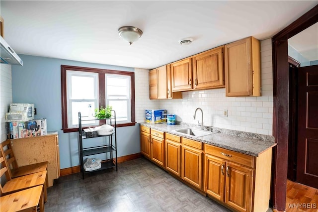 14 Phyllis Ave, Buffalo, NY 14215 - kitchen with backsplash, brown cabinetry, and light stone countertops