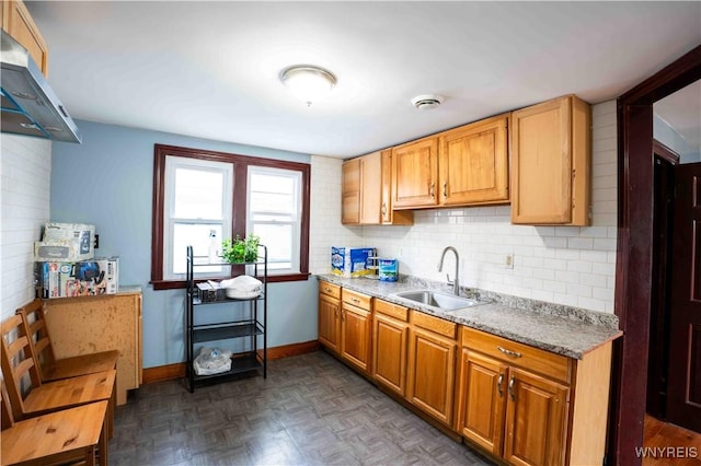 14 Phyllis Ave, Buffalo, NY 14215 - kitchen with extractor fan, backsplash, and light stone countertops