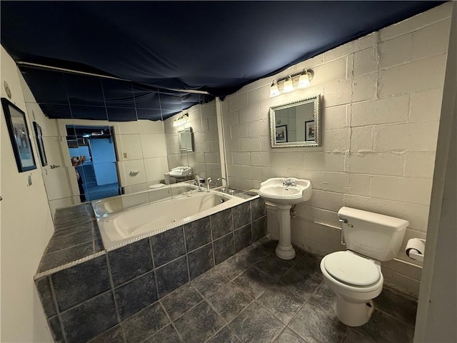 5 Breen St, Mount Morris, NY 14510 - full bath with a relaxing tiled tub and concrete block wall