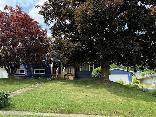 5 Breen St, Mount Morris, NY 14510 - view of property hidden behind natural elements featuring a front lawn and a garage