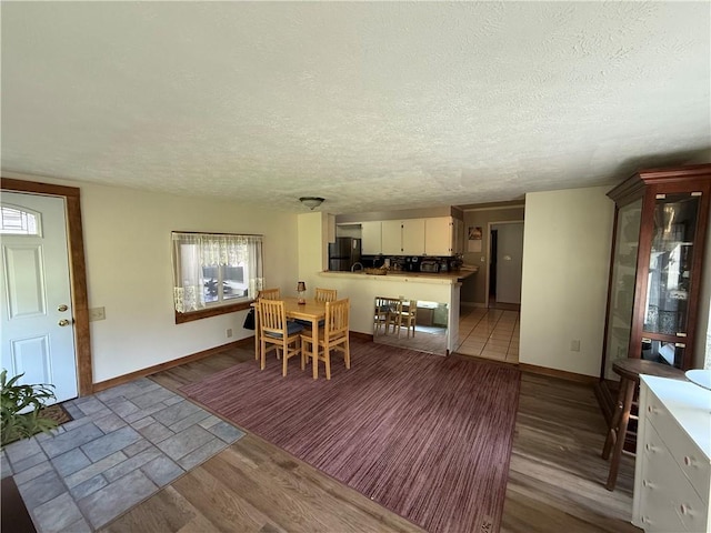 5 Breen St, Mount Morris, NY 14510 - dining room featuring light wood-type flooring and a textured ceiling