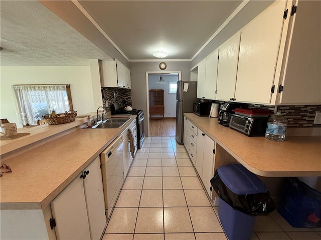 5 Breen St, Mount Morris, NY 14510 - kitchen featuring gas range oven, light tile patterned floors, white dishwasher, tasteful backsplash, and ornamental molding
