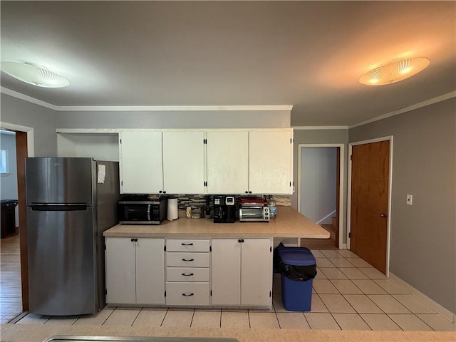 5 Breen St, Mount Morris, NY 14510 - kitchen with stainless steel appliances, light countertops, crown molding, white cabinets, and light tile patterned floors