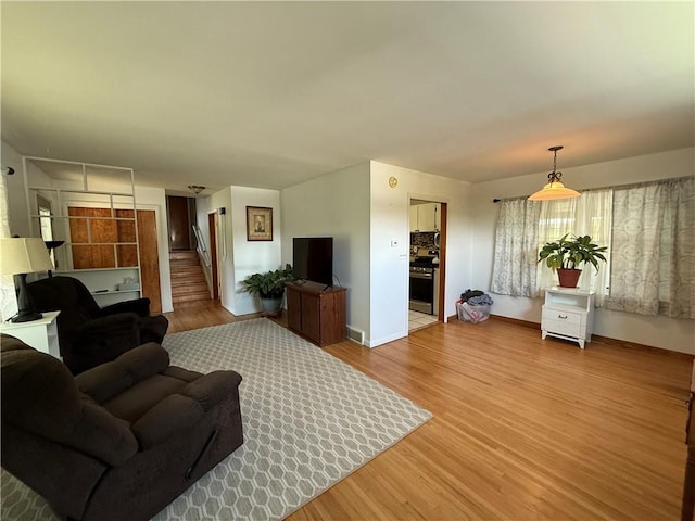 5 Breen St, Mount Morris, NY 14510 - living room featuring light wood finished floors and stairway