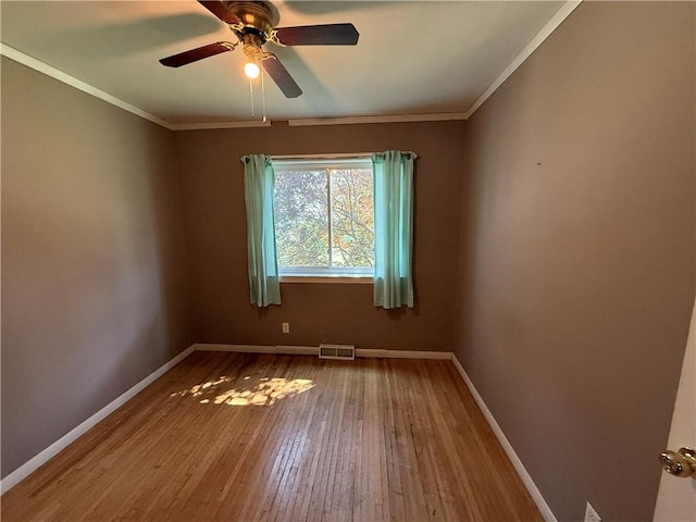 5 Breen St, Mount Morris, NY 14510 - empty room with wood-type flooring, ceiling fan, and ornamental molding