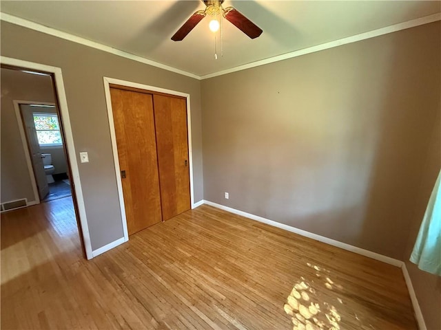 5 Breen St, Mount Morris, NY 14510 - unfurnished bedroom with wood finished floors, ornamental molding, a closet, and ceiling fan