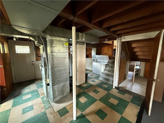 5 Breen St, Mount Morris, NY 14510 - basement featuring tile patterned floors, heating unit, and stairs