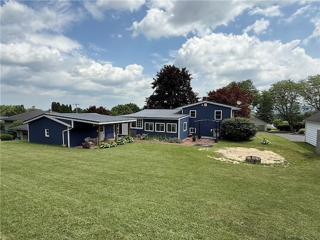 5 Breen St, Mount Morris, NY 14510 - rear view of house featuring a yard and an outdoor fire pit