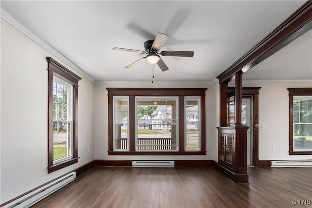 315 Otsego St, German Flatts, NY 13357 - spare room featuring a baseboard heating unit, dark wood-style floors, a baseboard radiator, decorative columns, and crown molding