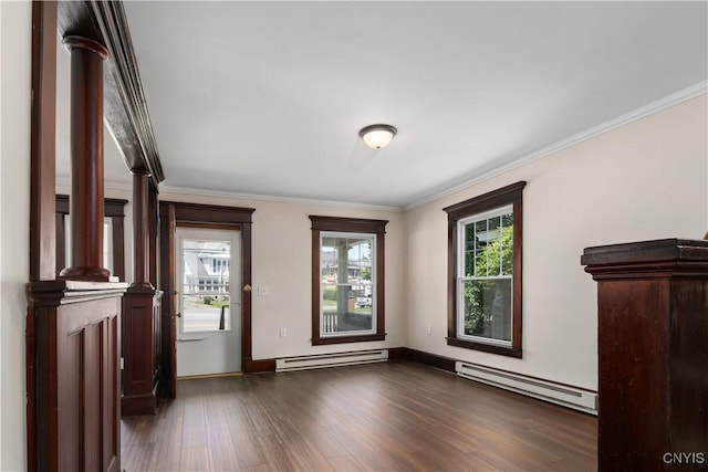315 Otsego St, German Flatts, NY 13357 - empty room featuring a baseboard heating unit, crown molding, and dark wood-type flooring