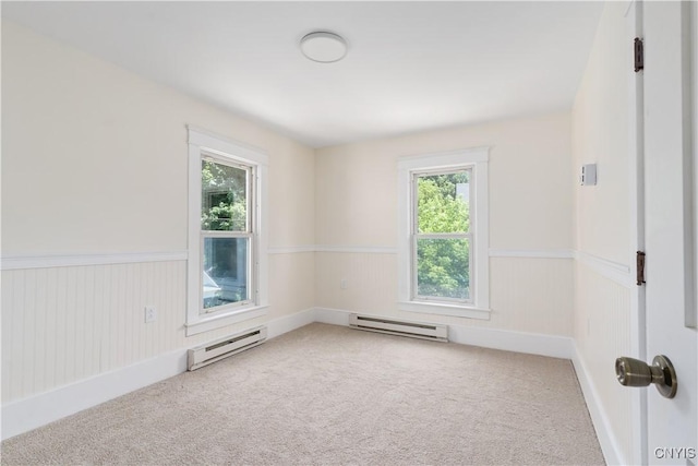 315 Otsego St, German Flatts, NY 13357 - carpeted spare room with a baseboard heating unit and wainscoting