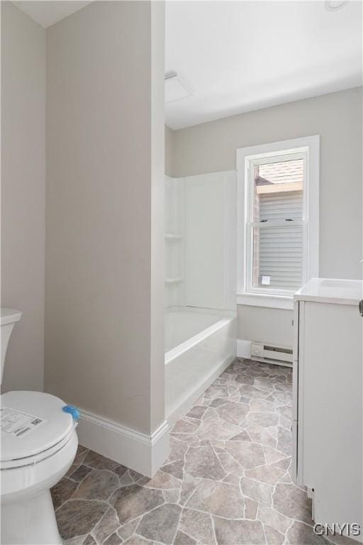315 Otsego St, German Flatts, NY 13357 - bathroom with a baseboard heating unit, stone finish flooring, vanity, and washtub / shower combination