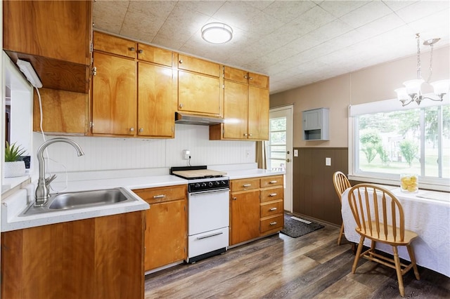 183 Castle Rd, Henrietta, NY 14623 - kitchen featuring white range with electric cooktop, dark wood-style flooring, a chandelier, and light countertops