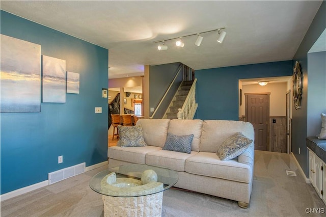 4043 Libra Ln, Clay, NY 13090 - carpeted living area featuring stairs and baseboards