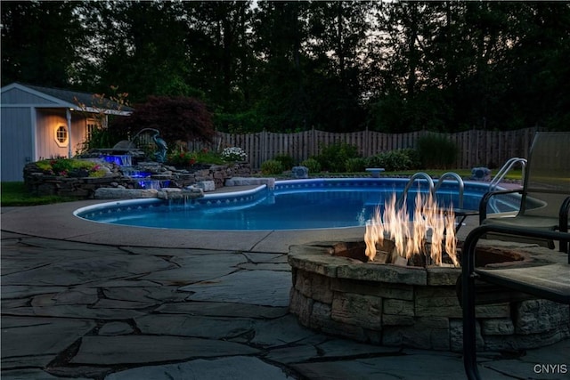 4043 Libra Ln, Clay, NY 13090 - view of swimming pool with an outdoor fire pit, a fenced backyard, a patio area, and a storage unit