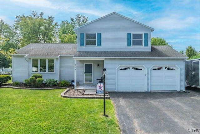 4043 Libra Ln, Clay, NY 13090 - view of front of house featuring driveway, a front yard, and a shingled roof
