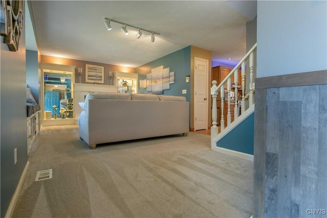 4043 Libra Ln, Clay, NY 13090 - carpeted living area featuring rail lighting and stairway