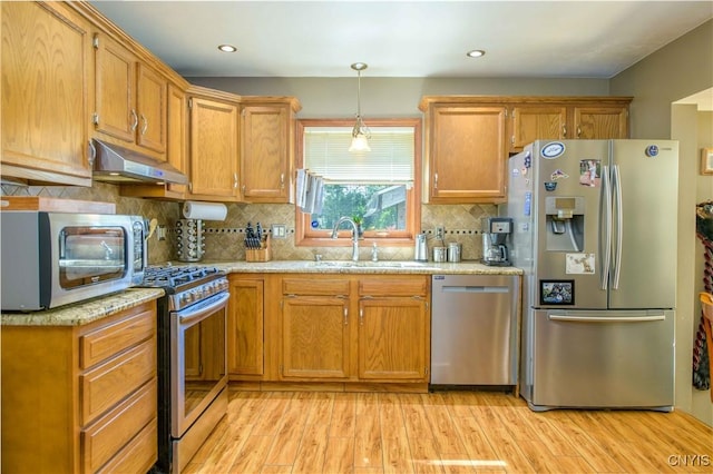 4043 Libra Ln, Clay, NY 13090 - kitchen featuring stainless steel appliances, under cabinet range hood, light wood-style floors, light stone counters, and recessed lighting