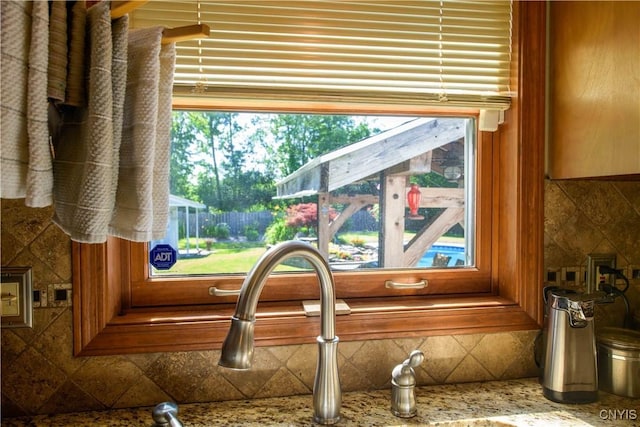 4043 Libra Ln, Clay, NY 13090 - kitchen view of tasteful backsplash and light stone countertops