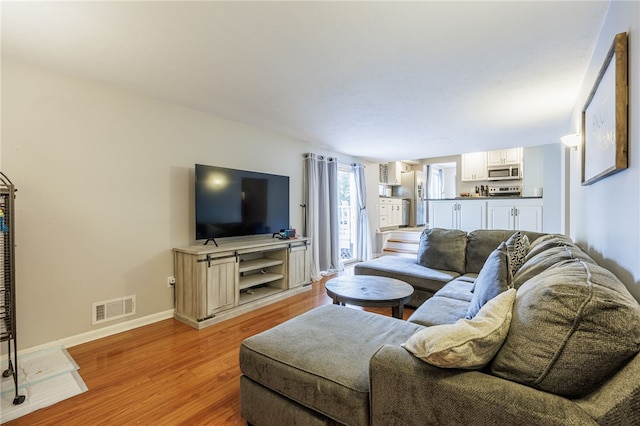 131 Cindy Ln, Greece, NY 14626 - living room featuring light wood finished floors and baseboards