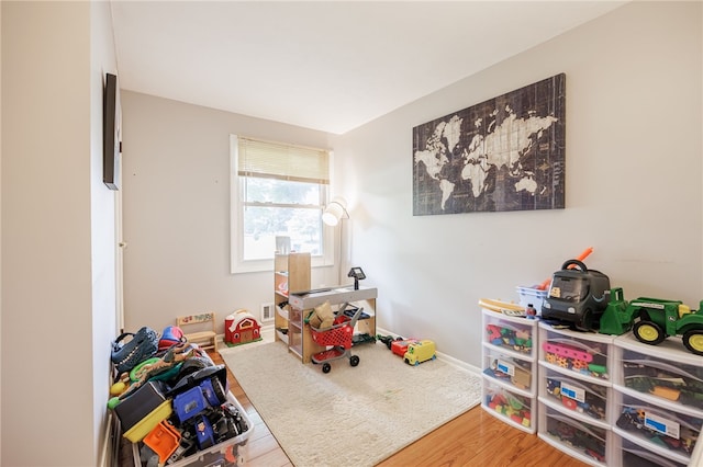 131 Cindy Ln, Greece, NY 14626 - rec room with wood finished floors and baseboards