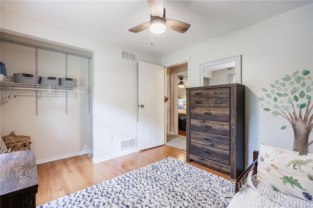 131 Cindy Ln, Greece, NY 14626 - bedroom featuring wood finished floors, a closet, and a ceiling fan