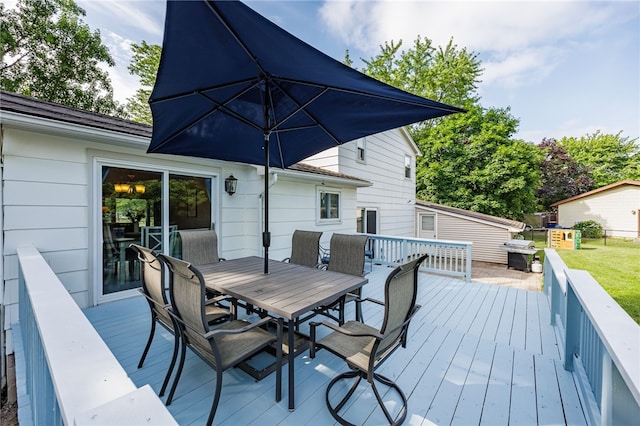 131 Cindy Ln, Greece, NY 14626 - wooden deck featuring outdoor dining area and area for grilling