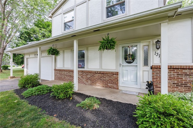 131 Cindy Ln, Greece, NY 14626 - entrance to property featuring brick siding and stucco siding