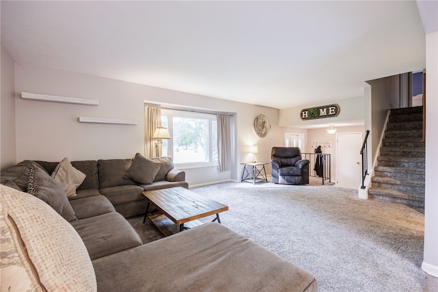 131 Cindy Ln, Greece, NY 14626 - carpeted living area featuring stairway and baseboards