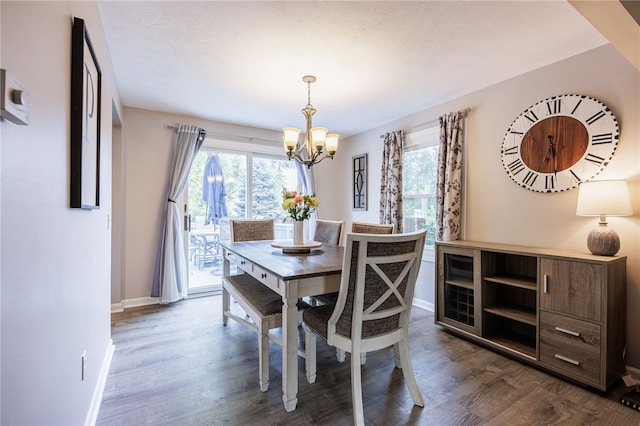 131 Cindy Ln, Greece, NY 14626 - dining space with a chandelier and dark wood-type flooring