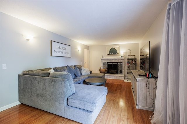 131 Cindy Ln, Greece, NY 14626 - living room featuring wood finished floors and a fireplace