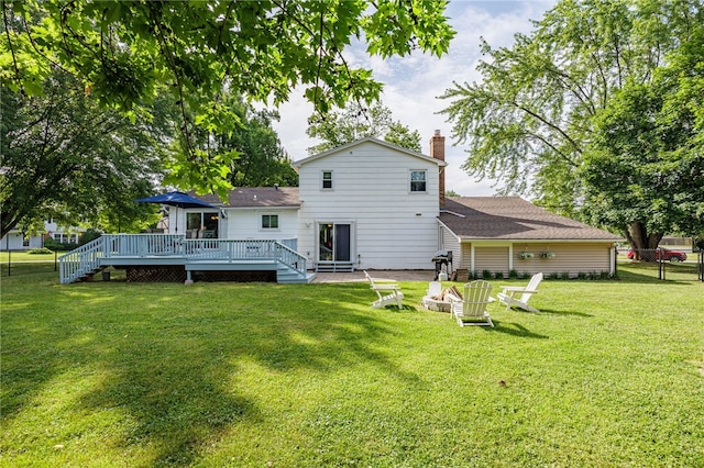 131 Cindy Ln, Greece, NY 14626 - back of house with a fire pit, a wooden deck, and a chimney