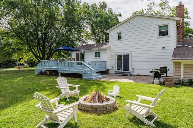 131 Cindy Ln, Greece, NY 14626 - back of house with an outdoor fire pit, a lawn, a deck, a patio, and roof with shingles