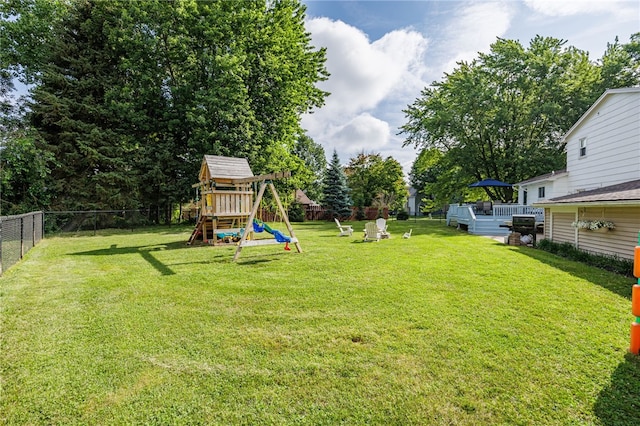 131 Cindy Ln, Greece, NY 14626 - fenced backyard with a playground and a wooden deck