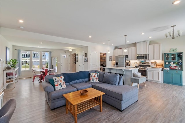 254 Longleaf Ln, Walworth, NY 14502 - living area featuring light wood-style flooring, recessed lighting, and a chandelier
