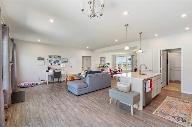 254 Longleaf Ln, Walworth, NY 14502 - living room with light wood finished floors, recessed lighting, and a chandelier
