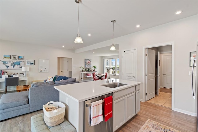 254 Longleaf Ln, Walworth, NY 14502 - kitchen featuring light wood-type flooring, open floor plan, light countertops, hanging light fixtures, and recessed lighting