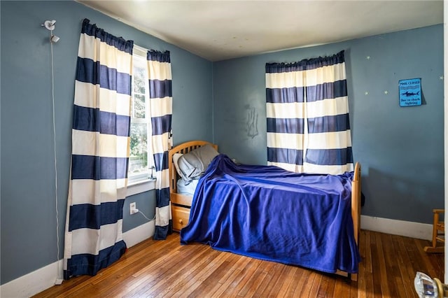 67 Pleasant St, Phelps, NY 14532 - bedroom with hardwood / wood-style flooring and baseboards