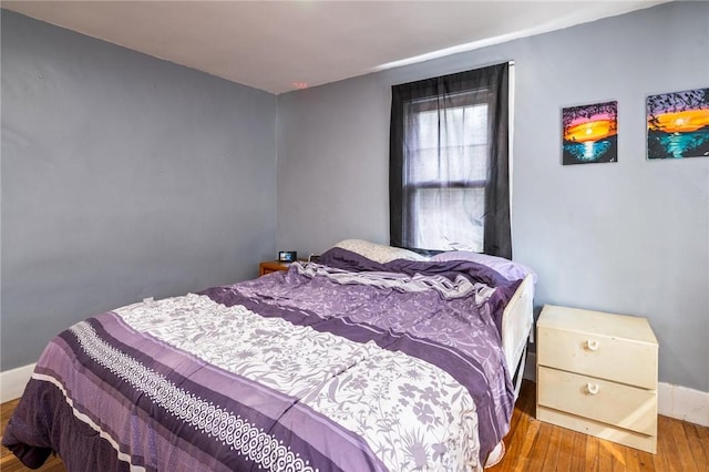 67 Pleasant St, Phelps, NY 14532 - bedroom with wood finished floors and baseboards