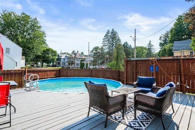 67 Pleasant St, Phelps, NY 14532 - view of pool with a deck, a fenced backyard, and an outdoor hangout area