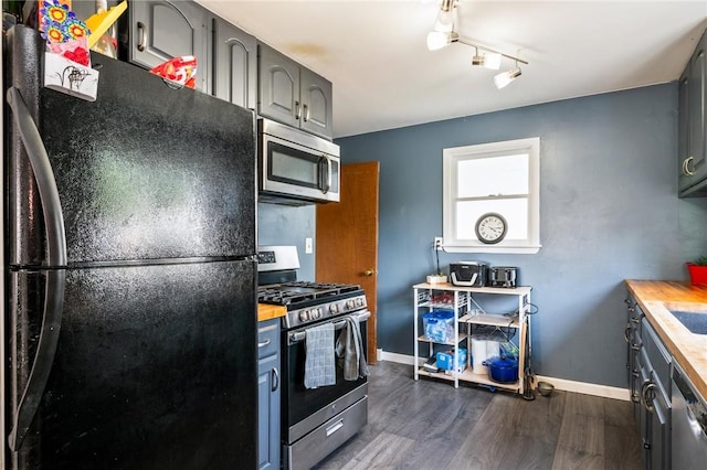 67 Pleasant St, Phelps, NY 14532 - kitchen with appliances with stainless steel finishes, butcher block countertops, dark wood finished floors, and gray cabinets