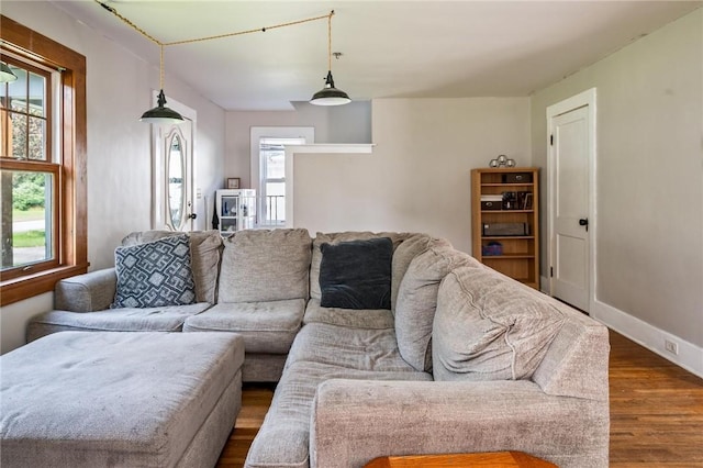 67 Pleasant St, Phelps, NY 14532 - living area featuring dark wood-style flooring and baseboards