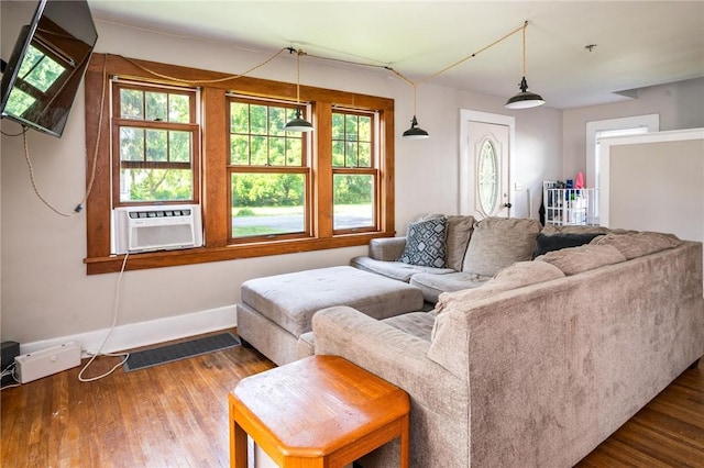 67 Pleasant St, Phelps, NY 14532 - living room featuring wood finished floors and cooling unit