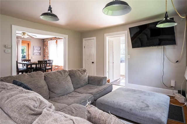 67 Pleasant St, Phelps, NY 14532 - living area featuring a ceiling fan and wood finished floors