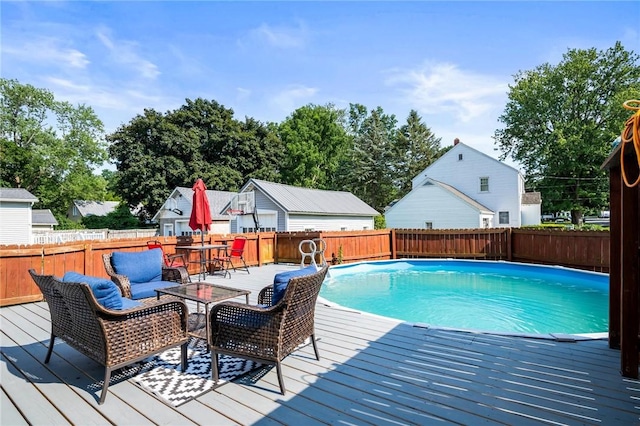 67 Pleasant St, Phelps, NY 14532 - view of swimming pool featuring a wooden deck, a fenced backyard, and outdoor lounge area