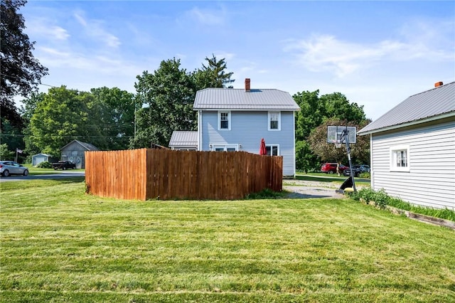 67 Pleasant St, Phelps, NY 14532 - back of property featuring a chimney and a metal roof