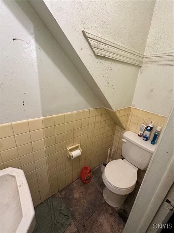 1417 Butternut St, Syracuse, NY 13208 - bathroom featuring tile walls, wainscoting, and tile patterned floors